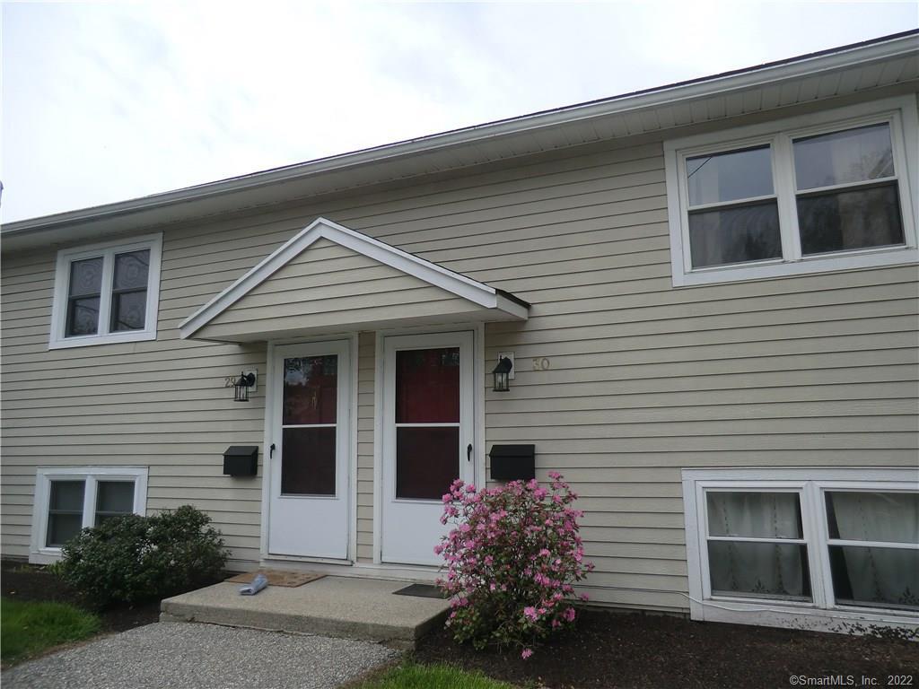 38 Sunny Valley Road, Unit 30 New Milford, CT 06776 - Photo 1 of 1 a front view of a house with a yard
