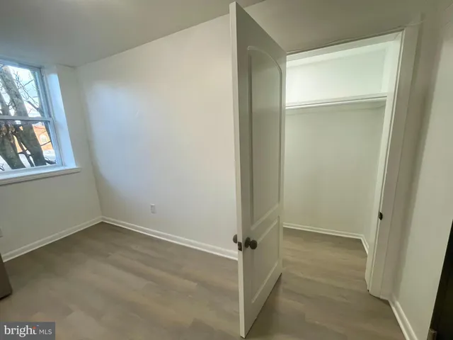 an empty room with mirror