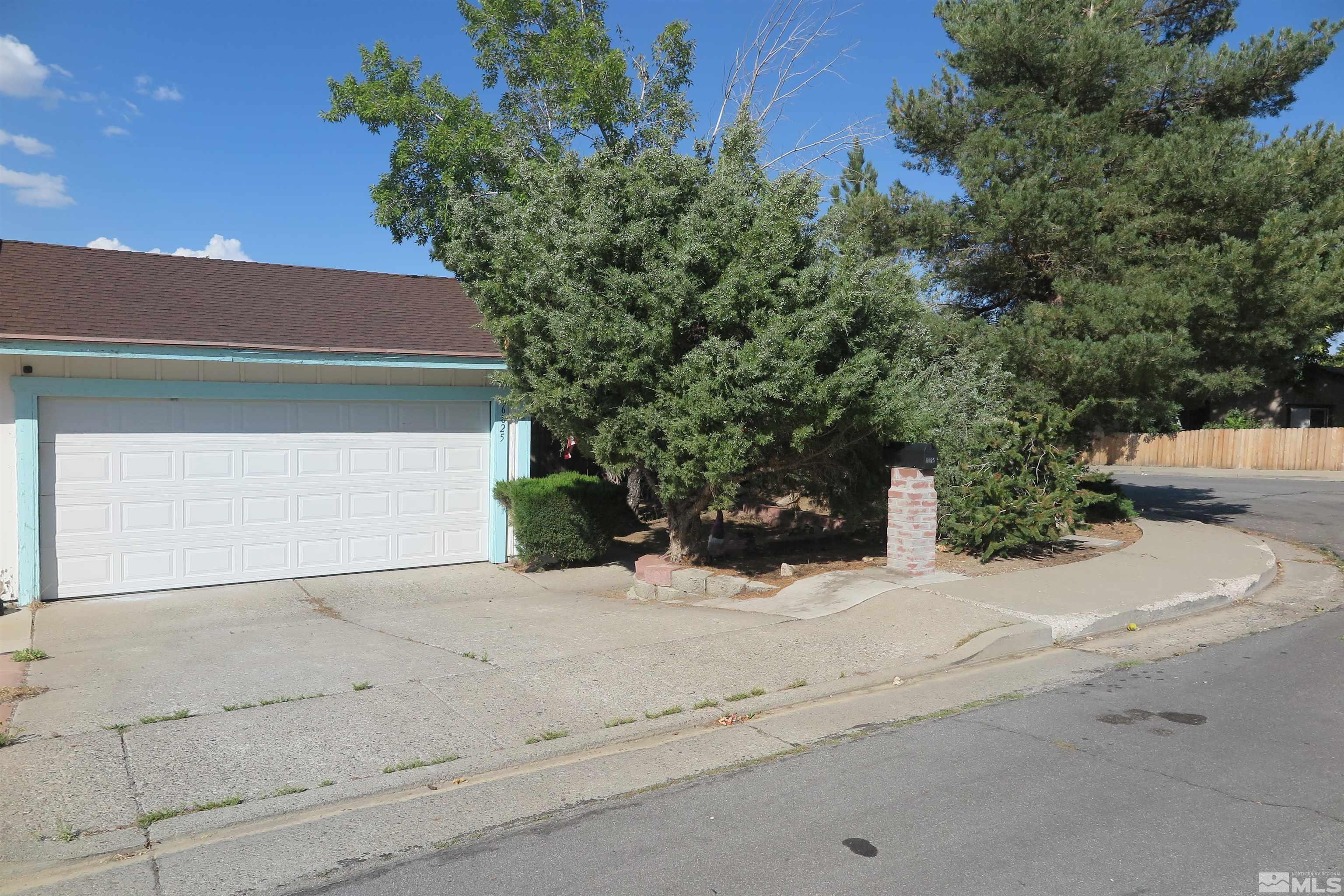 6825 Flower Street Reno, NV 89506 - Photo 1 of 35 front view of a house with a yard
