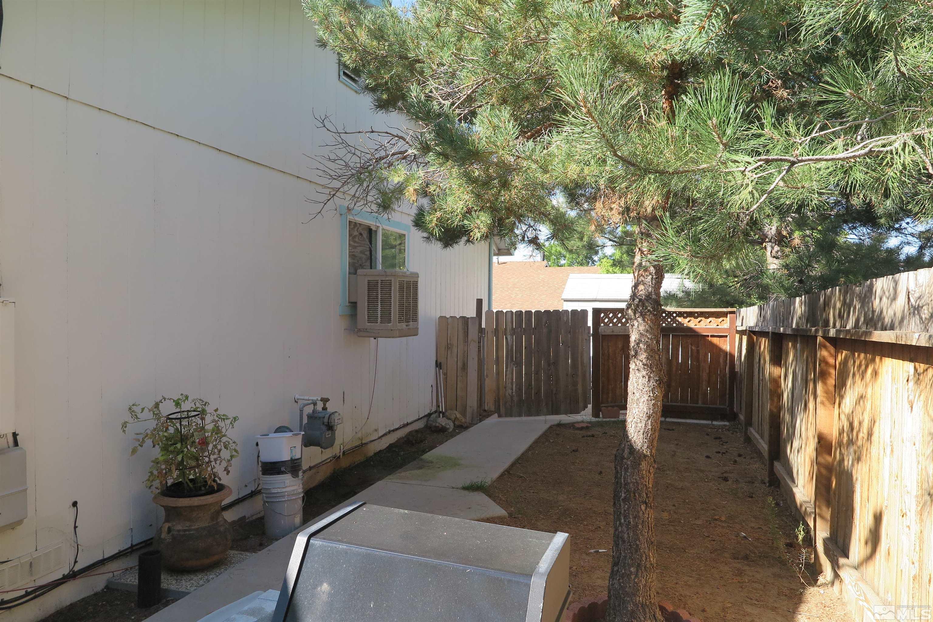 6825 Flower Street Reno, NV 89506 - Photo 12 of 35 a backyard of a house with lots of green space
