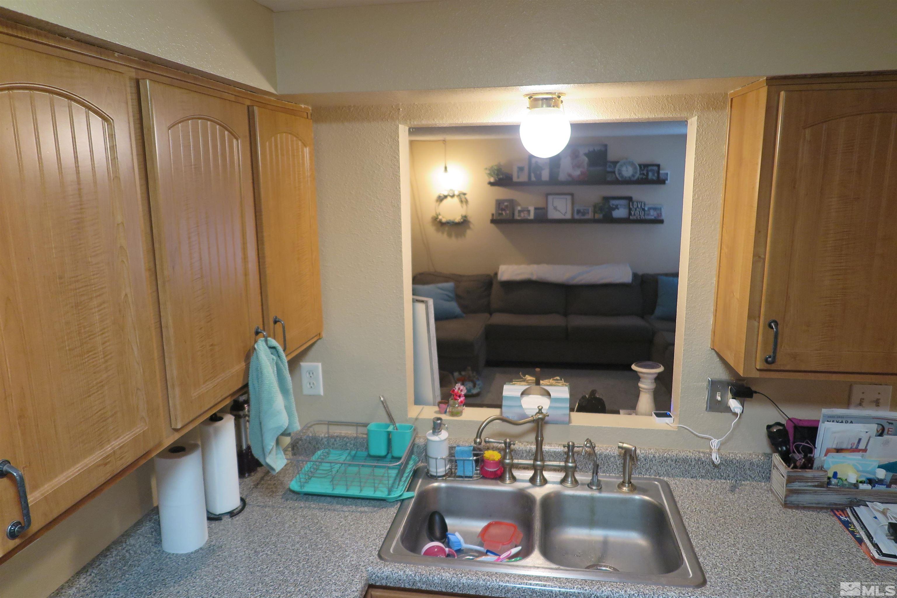 6825 Flower Street Reno, NV 89506 - Photo 21 of 35 a bathroom with a sink and a mirror
