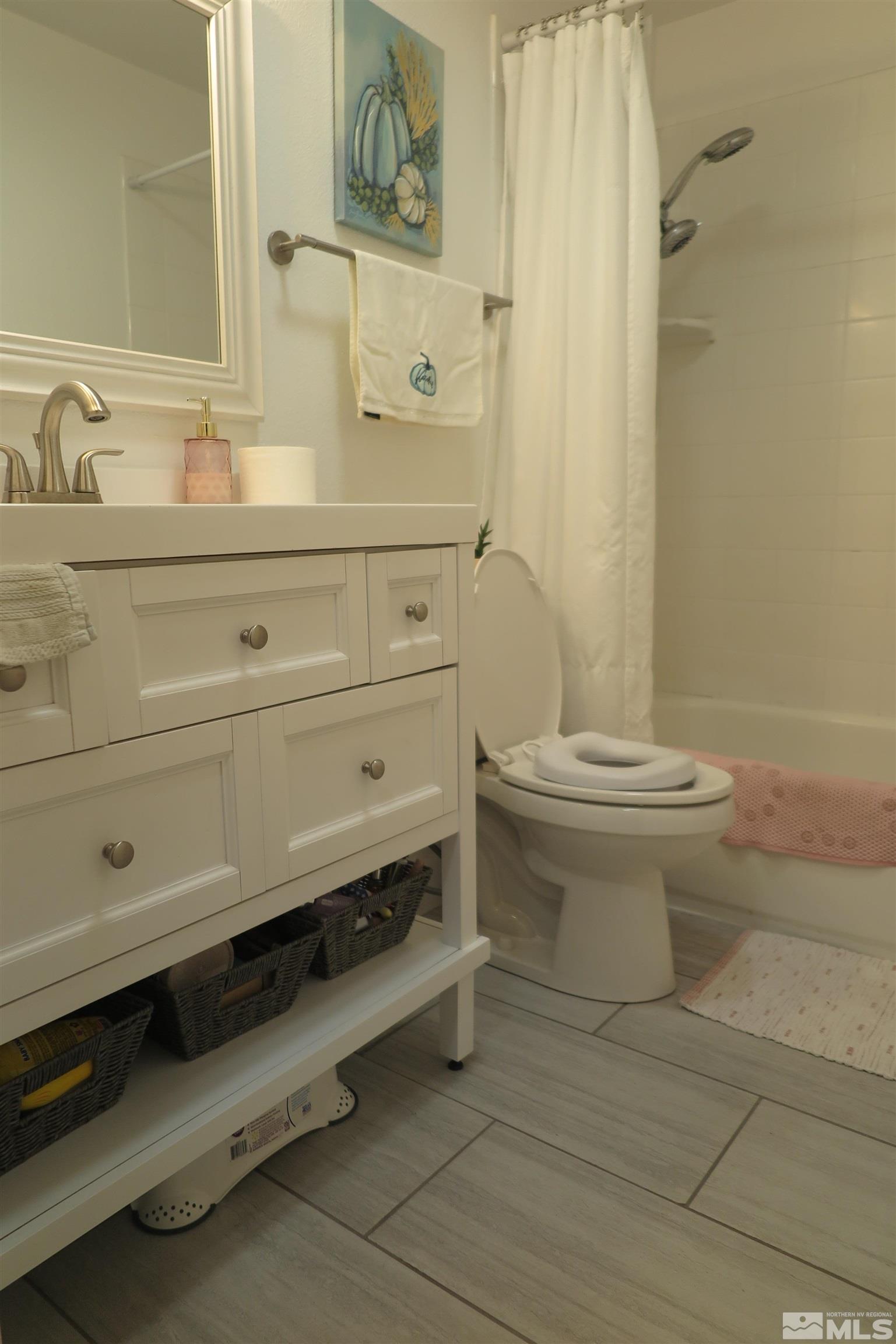 6825 Flower Street Reno, NV 89506 - Photo 23 of 35 a bathroom with a sink a toilet and shower