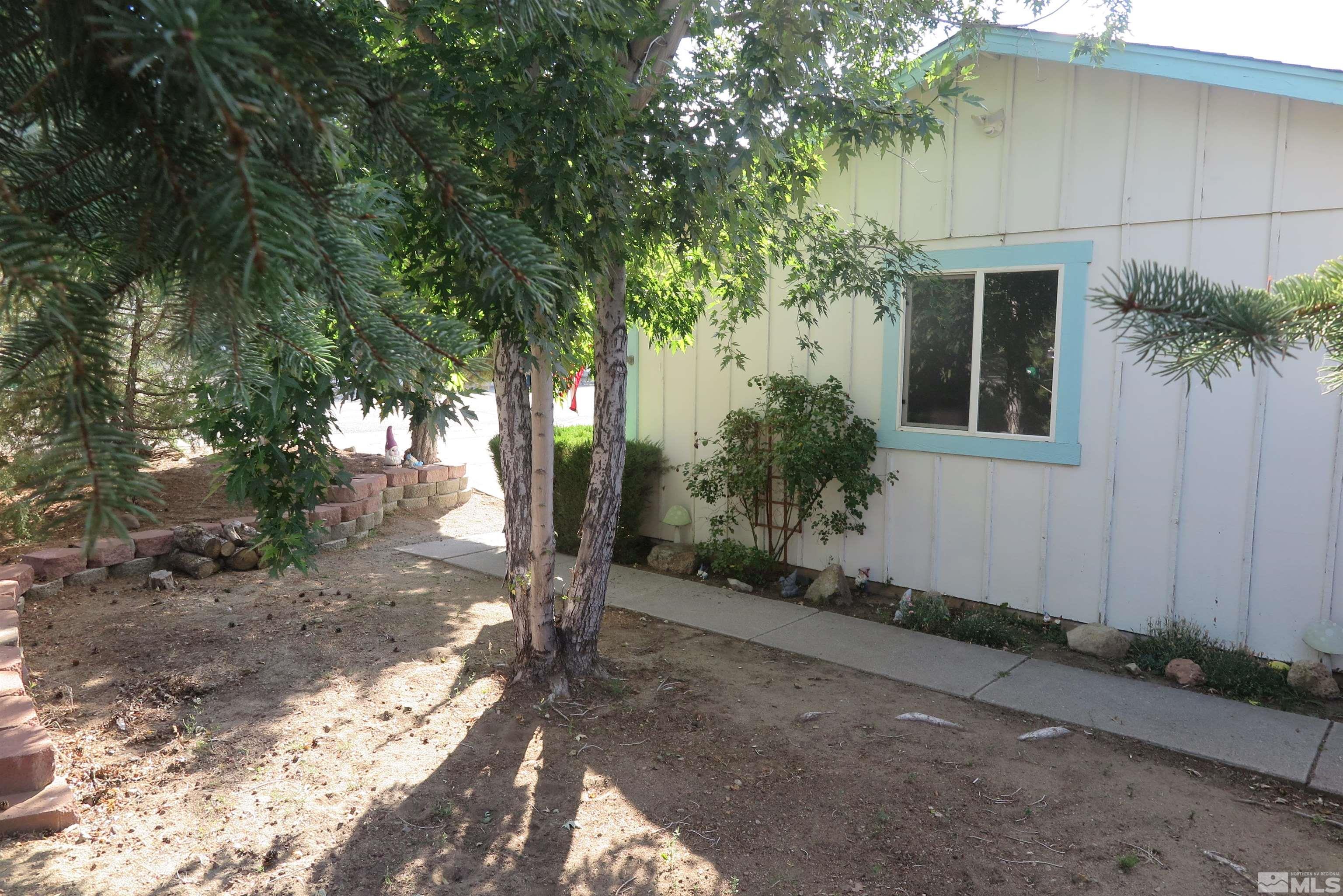 6825 Flower Street Reno, NV 89506 - Photo 3 of 35 a view of a house with a tree