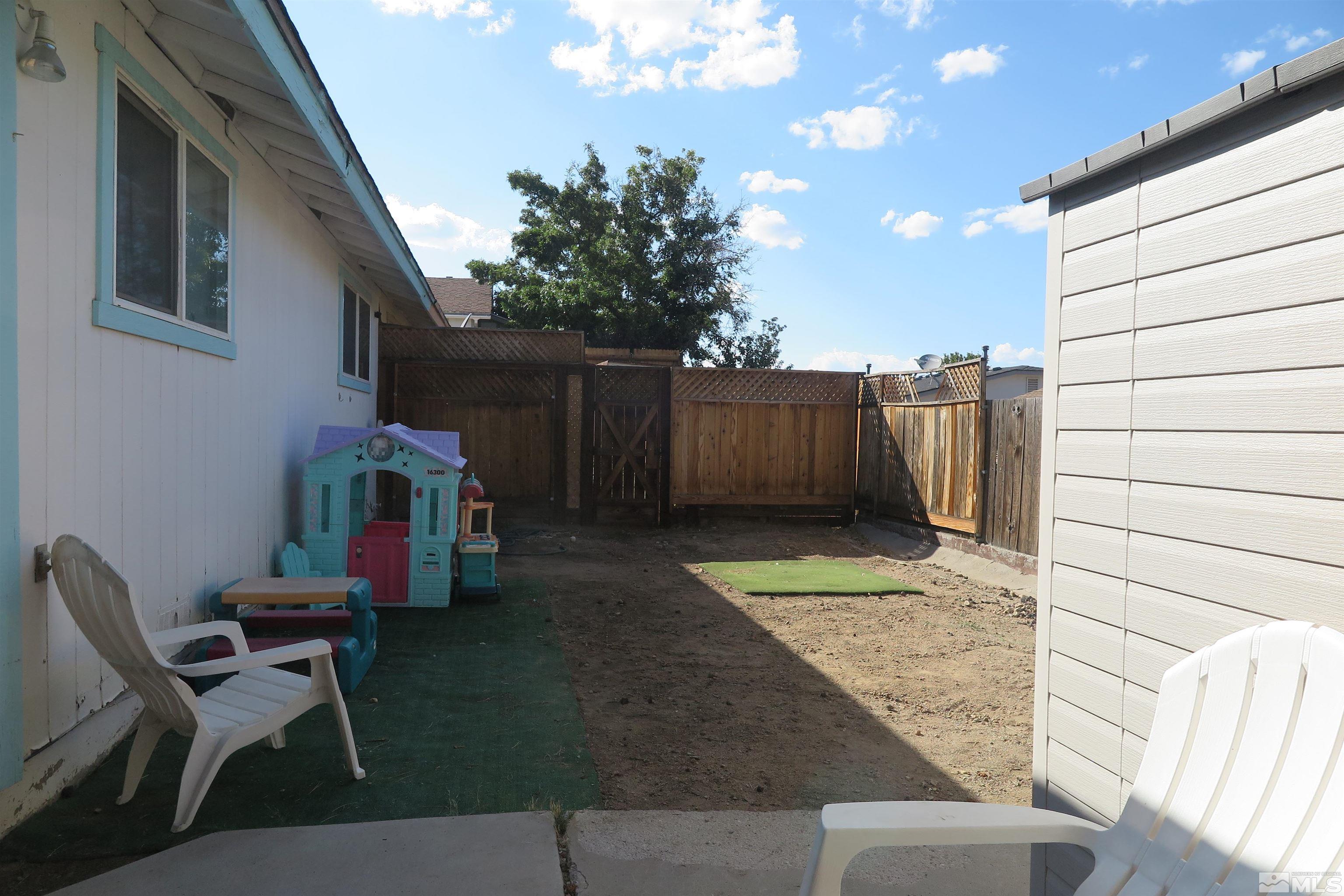 6825 Flower Street Reno, NV 89506 - Photo 33 of 35 a view of a backyard with furniture and a cabin