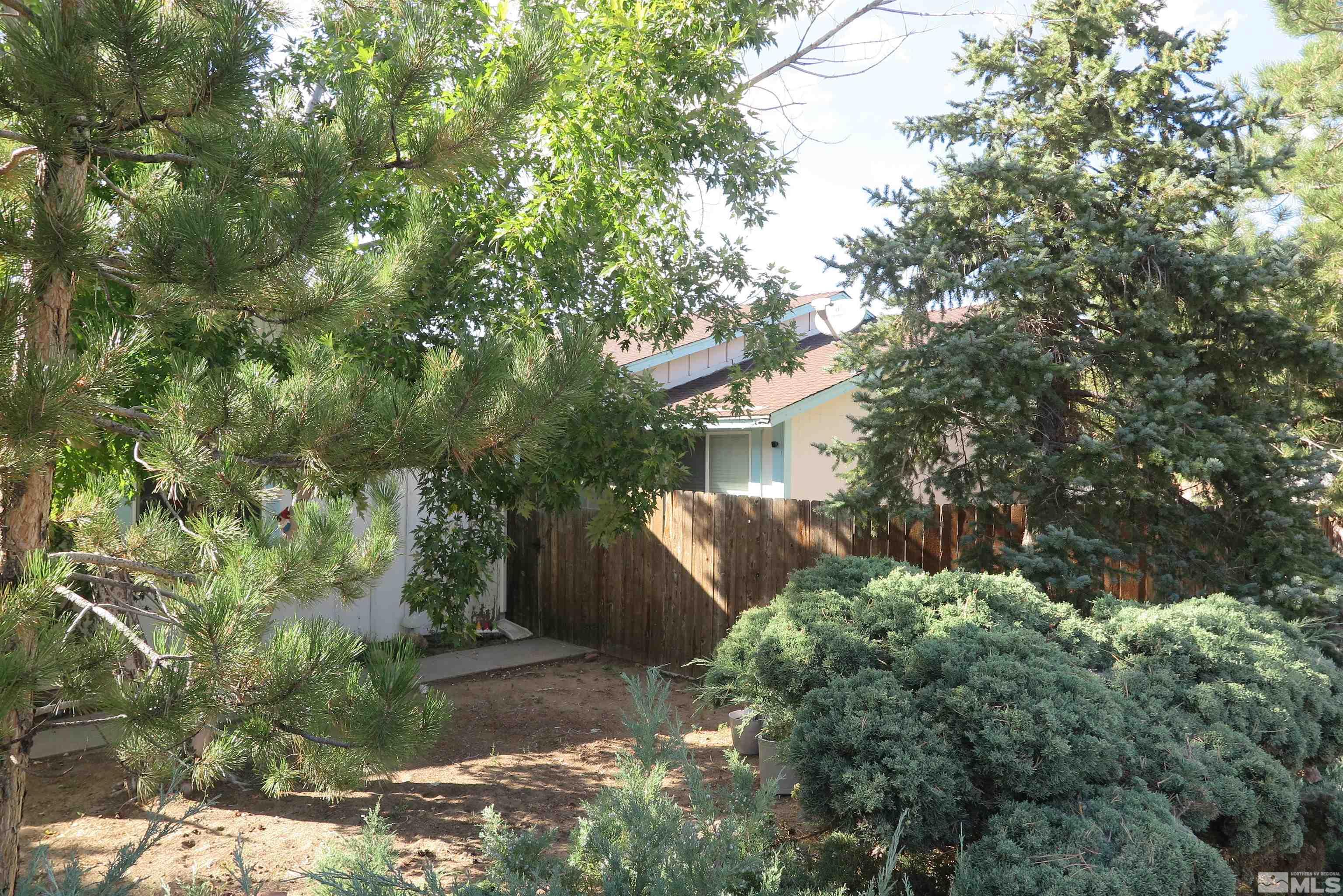 6825 Flower Street Reno, NV 89506 - Photo 7 of 35 a view of a house with a tree