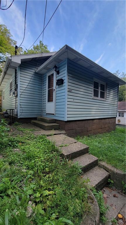 1520 12th Avenue Beaver Falls, PA 15010 - Photo 1 of 1 a backyard of a house with lots of green space