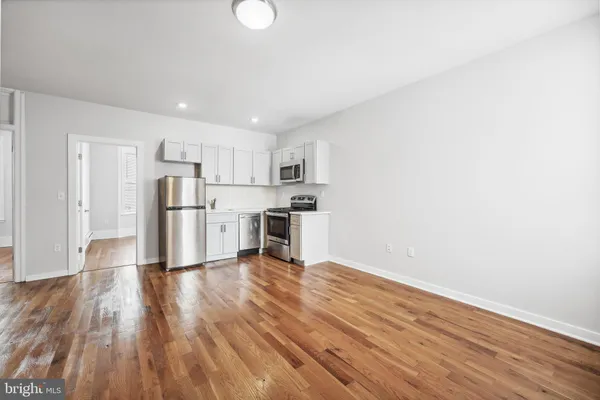 a view of kitchen with wooden floor