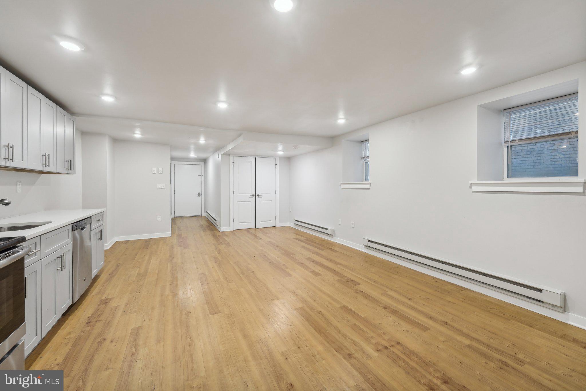4300 Chestnut Street, Unit 2 Philadelphia, PA 19104 - Photo 21 of 30 a view of an empty room with wooden floor