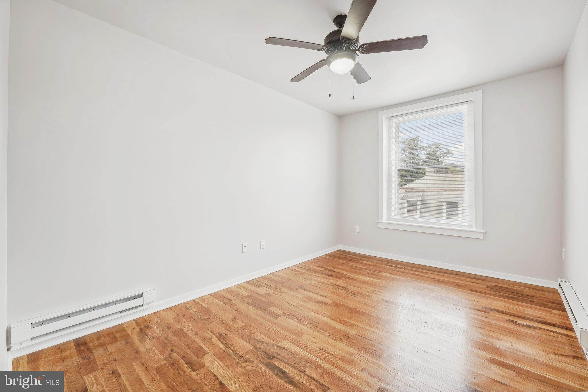4300 Chestnut Street, Unit 2 Philadelphia, PA 19104 - Photo 8 of 30 wooden floor in an empty room with a window