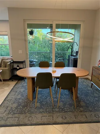 a outdoor dining space with furniture and outdoor view