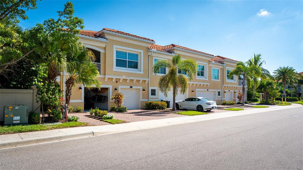 80 Navigation Circle Osprey, FL 34229 - Photo 2 of 36 a front view of a house with a yard and a garage