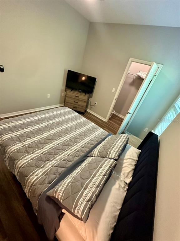 80 Navigation Circle Osprey, FL 34229 - Photo 22 of 36 a bedroom with a bed and window