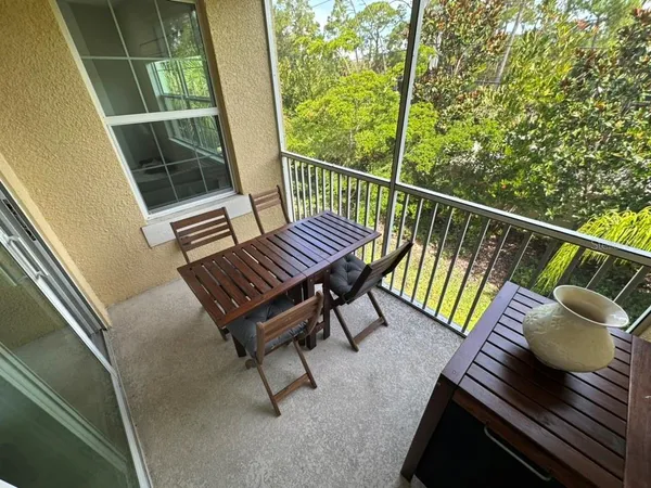 a view of a balcony with chairs