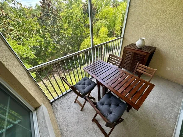 a view of a balcony with chairs