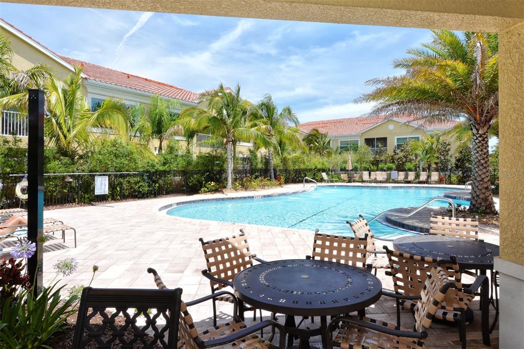 80 Navigation Circle Osprey, FL 34229 - Photo 29 of 36 a view of a patio with table and chairs and potted plants