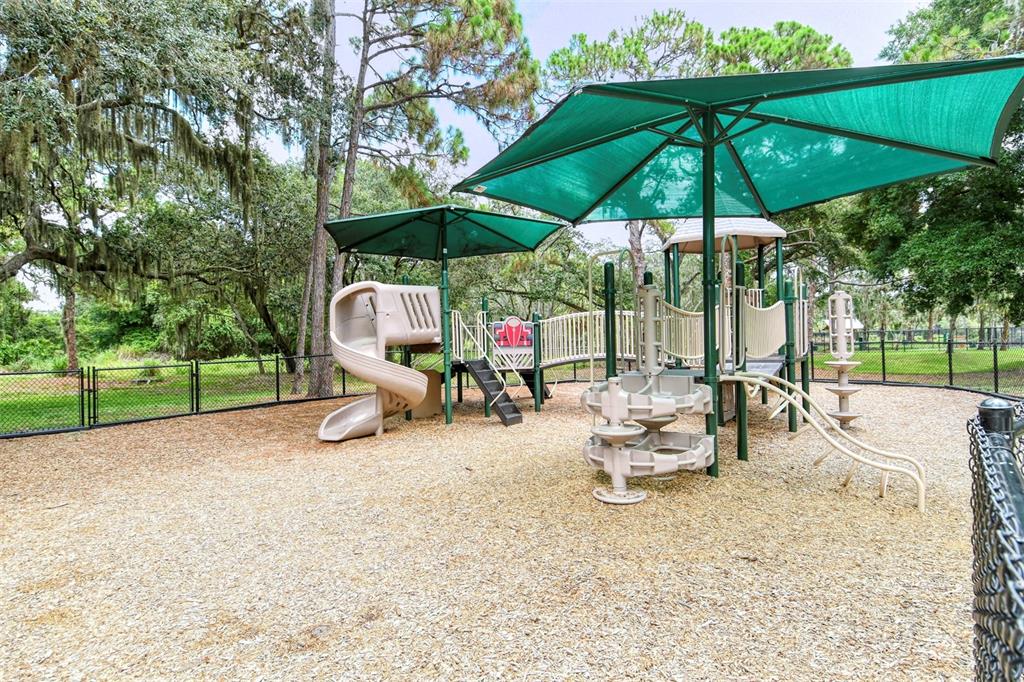 80 Navigation Circle Osprey, FL 34229 - Photo 36 of 36 a view of backyard with a patio and outdoor seating