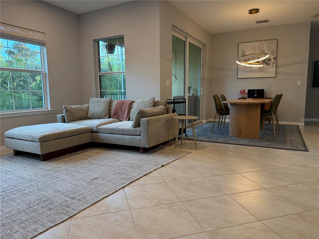 80 Navigation Circle Osprey, FL 34229 - Photo 7 of 36 a living room with furniture and a window