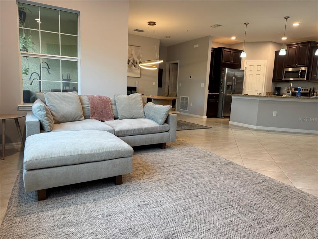 80 Navigation Circle Osprey, FL 34229 - Photo 8 of 36 a living room with furniture and a large window