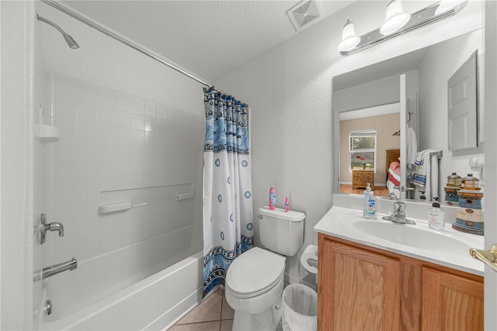 9175 Southeast 118th Loop Summerfield, FL 34491 - Photo 14 of 28 a bathroom with a sink toilet and shower