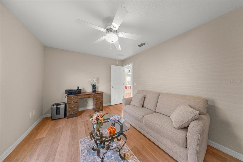 9175 Southeast 118th Loop Summerfield, FL 34491 - Photo 16 of 28 a living room with furniture and wooden floor