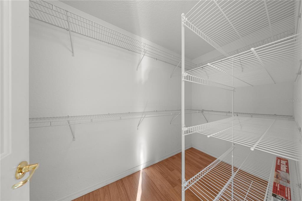 9175 Southeast 118th Loop Summerfield, FL 34491 - Photo 20 of 28 a view of a room with racks on the wall