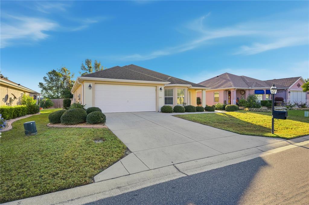9175 Southeast 118th Loop Summerfield, FL 34491 - Photo 2 of 28 a view of house with a yard and potted plants