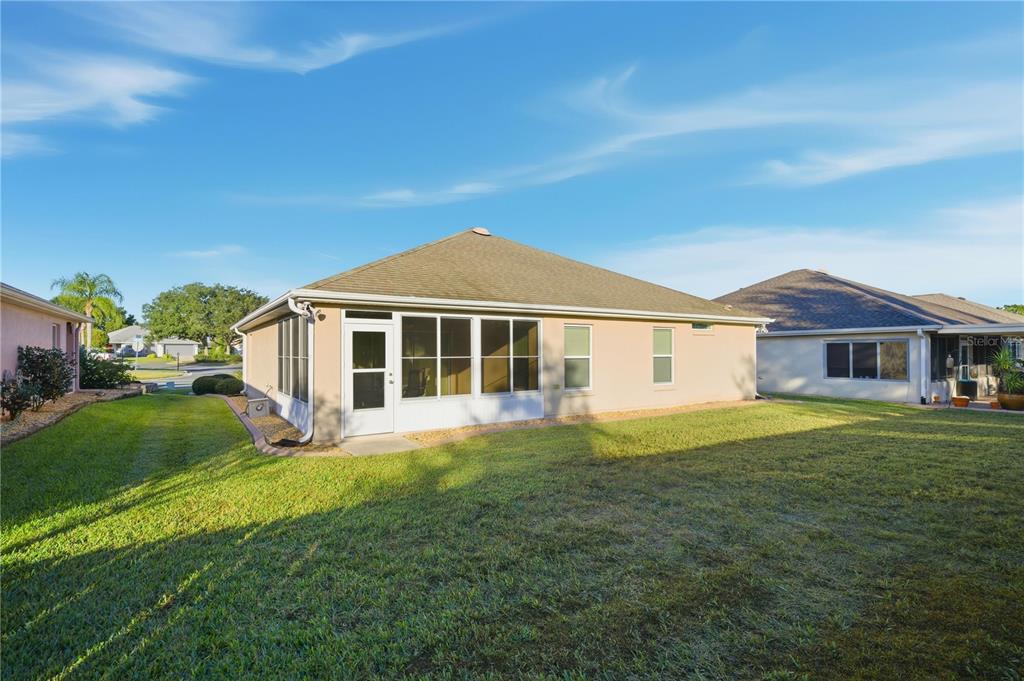 9175 Southeast 118th Loop Summerfield, FL 34491 - Photo 25 of 28 a front view of a house with a yard