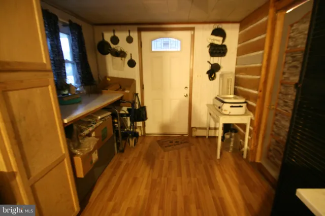 a view of walk in closet with wooden floor