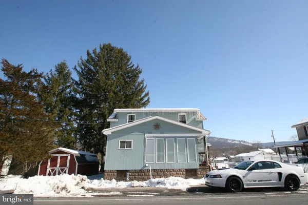 a view of street with parked cars