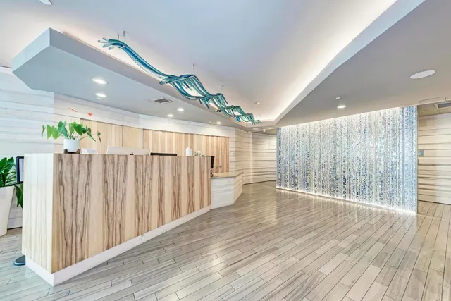 a bedroom with furniture and a book shelf