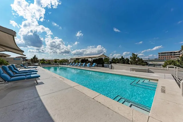 a view of swimming pool from a balcony