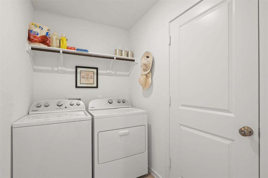 7229 Adderly Road Pilot Point, TX 76258 - Photo 17 of 34 a utility room with dryer and washer