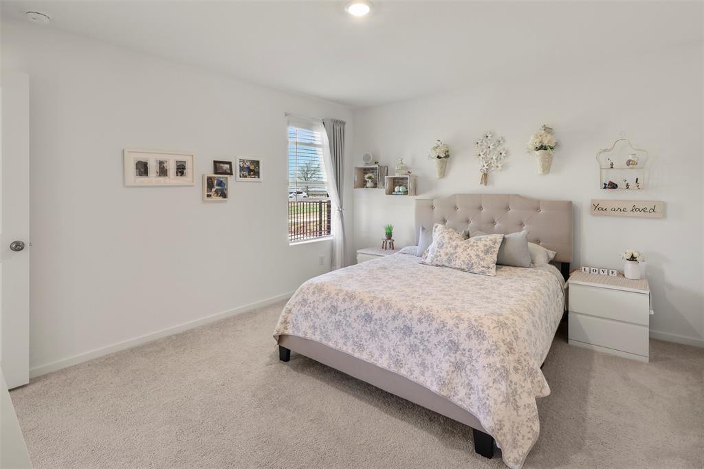 7229 Adderly Road Pilot Point, TX 76258 - Photo 20 of 34 a bedroom with a bed and a window