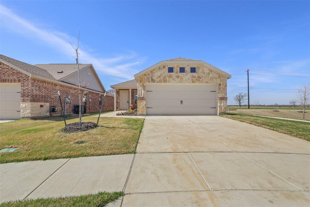7229 Adderly Road Pilot Point, TX 76258 - Photo 2 of 34 a view of a house with a backyard
