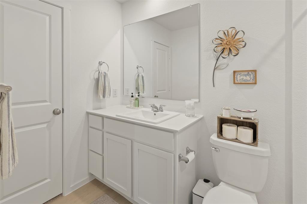 7229 Adderly Road Pilot Point, TX 76258 - Photo 23 of 34 a bathroom with a sink a toilet and shower