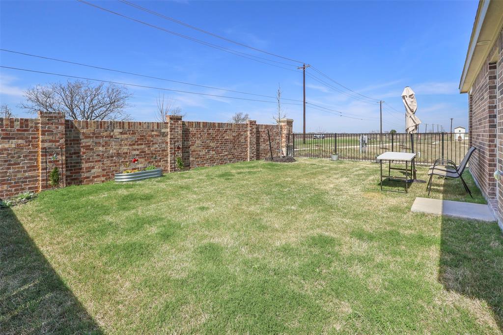 7229 Adderly Road Pilot Point, TX 76258 - Photo 26 of 34 a view of a backyard with lawn chairs