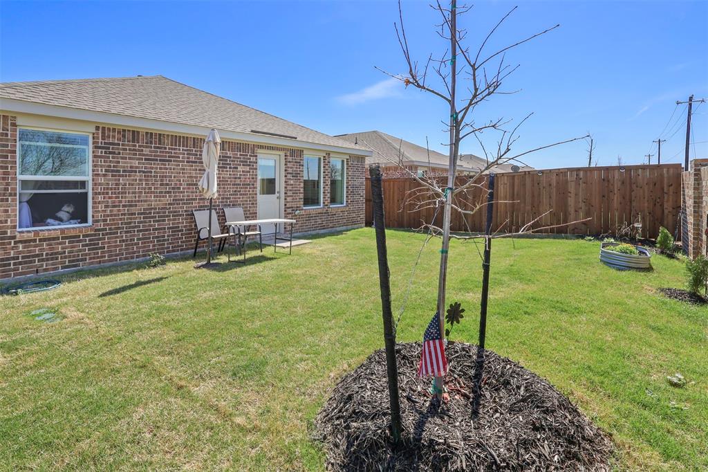 7229 Adderly Road Pilot Point, TX 76258 - Photo 27 of 34 a garden view with a seating space