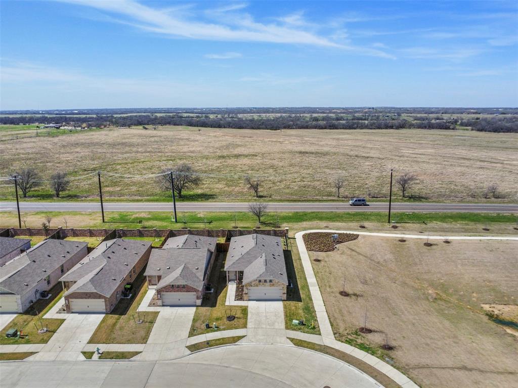 7229 Adderly Road Pilot Point, TX 76258 - Photo 30 of 34 an aerial view of a house with a ocean view