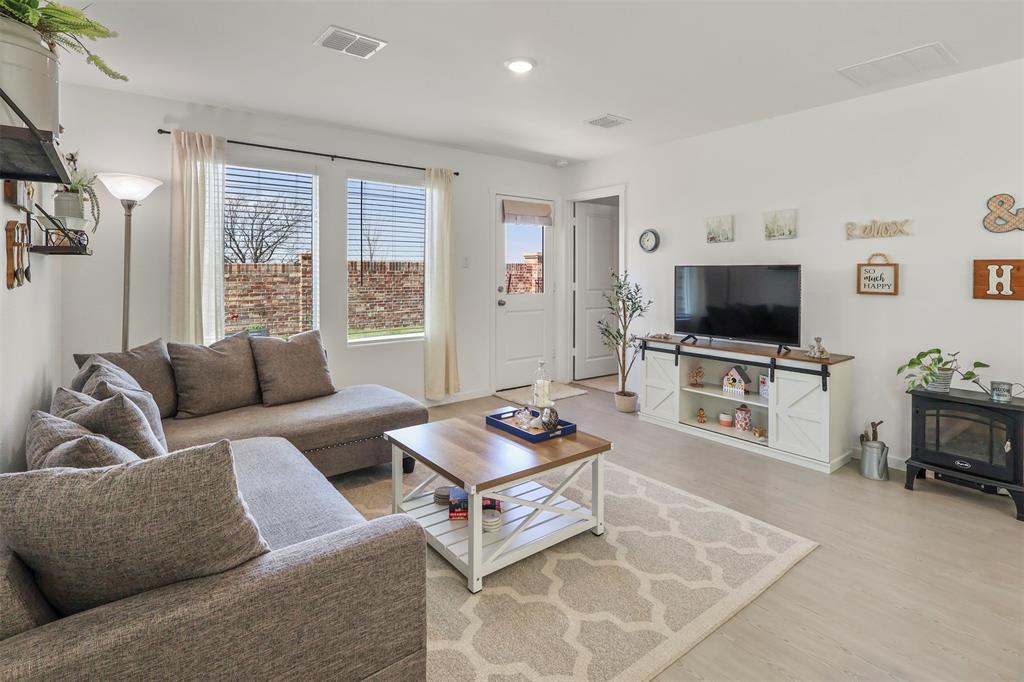 7229 Adderly Road Pilot Point, TX 76258 - Photo 7 of 34 a living room with furniture and a flat screen tv
