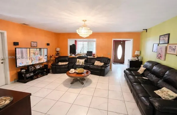 a living room with furniture fireplace and flat screen tv