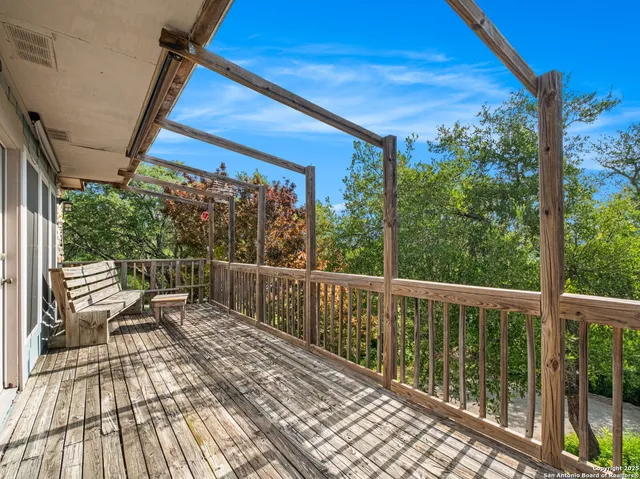 a view of a two chairs in the balcony