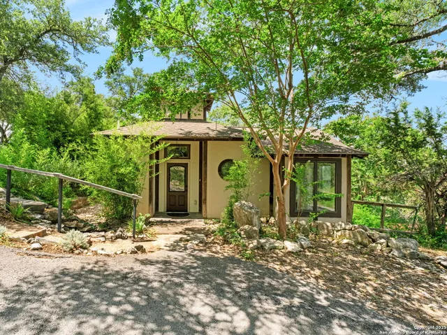 a view of an entryway with a wooden door