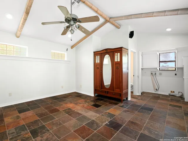 a view of a room with wooden floor