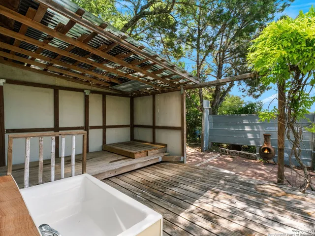 a backyard of a house with outdoor seating