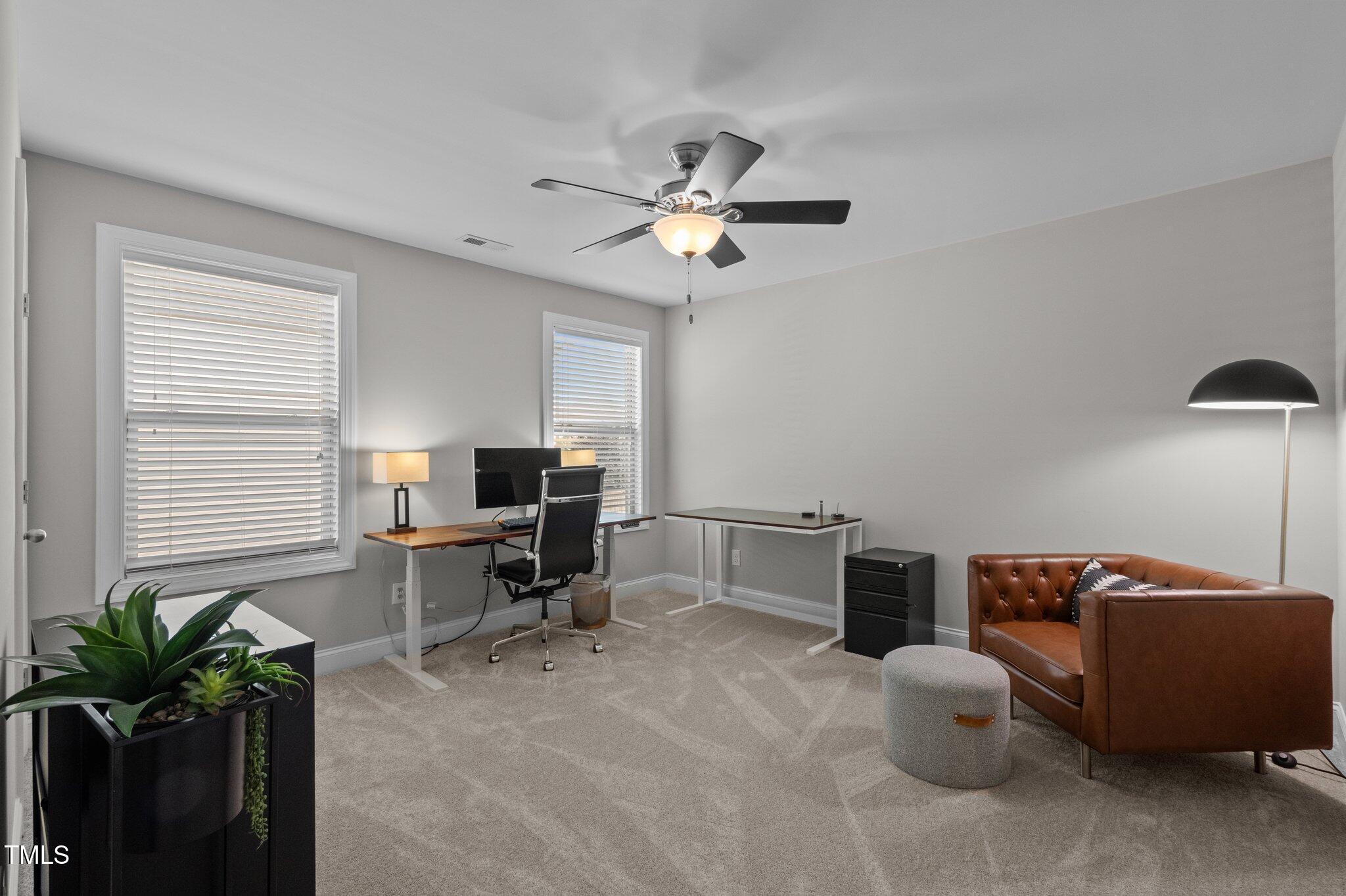 212 Crisp Road Durham, NC 27713 - Photo 24 of 36 a workspace with furniture and a potted plant