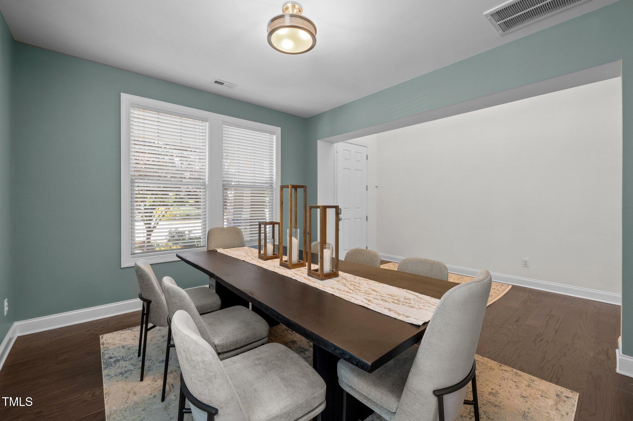 212 Crisp Road Durham, NC 27713 - Photo 4 of 36 a view of a dining room with a table and chairs