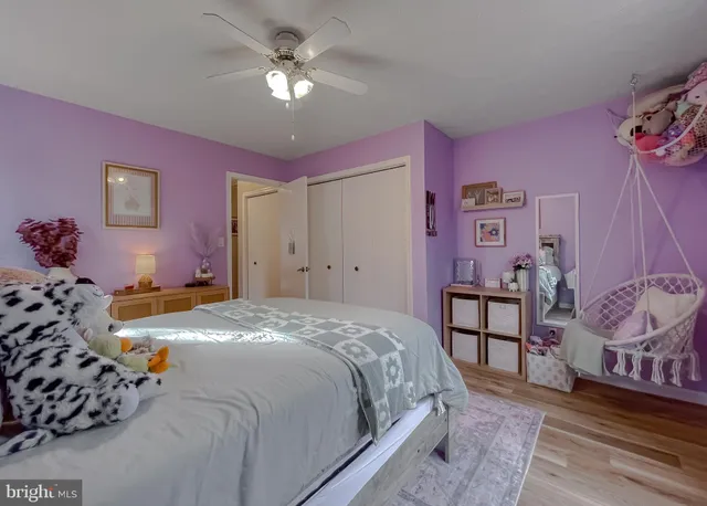 a spacious bathroom with a double vanity sink and a mirror