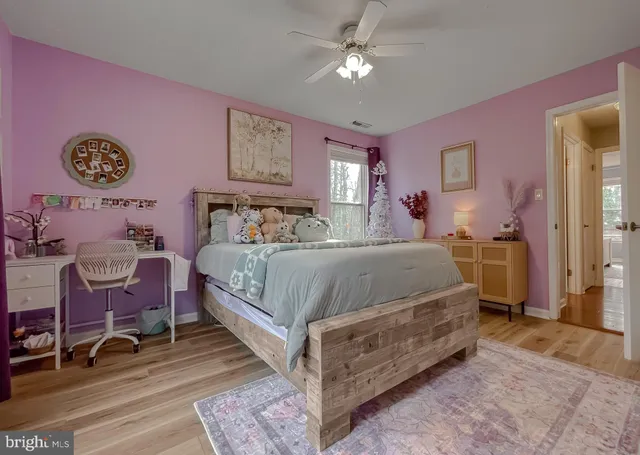 a bathroom with a sink mirror and toilet
