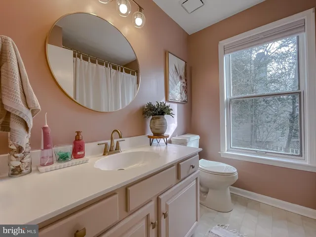 a bed room with a bed and a chandelier