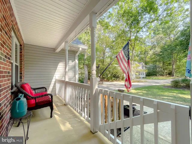 a view of a two chairs and table in the balcony